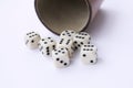 Dice game with dice cup on white table casino concept