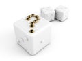 Dice with gold question-mark