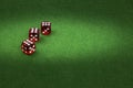 Dice on green felt, gambling background concept Royalty Free Stock Photo