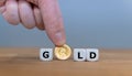 Dice and a Krugerrand coin form the word `GOLD`