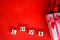 Dice with LOVE letters and gift boxes as elements. Royalty Free Stock Photo