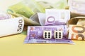 Dice and money. Two sixes on dice and euro banknote on yellow background. win, luck concept. Copy space. Selective focus Royalty Free Stock Photo