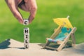 Dice placed next to a beach chair form the word `chill` Royalty Free Stock Photo