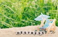 Dice placed next to a beach chair form the word `destress`