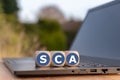 Dice placed on a notebook for with the abbreviation `SCA`