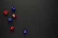 dice red and blue and yellow color black background Royalty Free Stock Photo