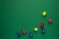 dice red and blue and yellow color green background Royalty Free Stock Photo