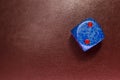 dice on a red leather
