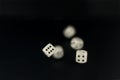 Dice roll in flight on black matte background