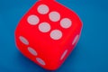 Lucky Roll: Dice Showing Six on Vibrant Blue Background Royalty Free Stock Photo