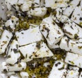 Dice sliced greek feta cheese ith spices Royalty Free Stock Photo