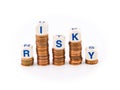 Dice Spelling Risky on Penny Stacks Royalty Free Stock Photo