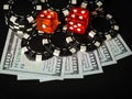 Dice and stacks of chips on the money from winning the poker club. A successful combination brought a rich win Royalty Free Stock Photo