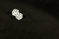 Dice on the table on a black background. Royalty Free Stock Photo