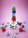 Dice tower on pink background, vignetting effect