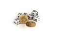 Dice and two commemorative dollars on a white background Royalty Free Stock Photo
