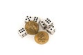 Dice and two commemorative dollars on a white background Royalty Free Stock Photo