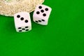 Dice white on green cloth or cloth Royalty Free Stock Photo