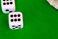 Dice white on green cloth or cloth Royalty Free Stock Photo