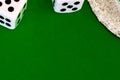 Dice white on green cloth or cloth