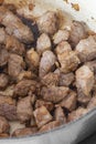 Diced beef with onions, Aberdeen Angus beef, cooking in a casserole dish