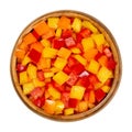 Diced peppers, cut sweet pepper in a wooden bowl Royalty Free Stock Photo