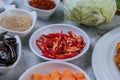 Diced carrots, dried chilies, roasted rice, chili, and cabbage