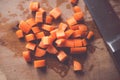 Chopped carrots on wooden board Royalty Free Stock Photo