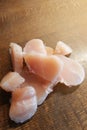 Diced chicken pieces of healthy lean white meat on a cutting board, filleted for cooking Royalty Free Stock Photo