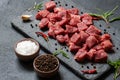 Diced cubed beef meat on stone board