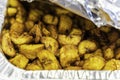 Diced Nigerian Plantain in Aluminum container served at Nigerian Party