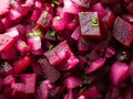 Diced pickled beetroot salad with fresh herbs and onions in close-up Royalty Free Stock Photo
