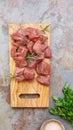 Diced raw meat with a sprig of rosemary Royalty Free Stock Photo