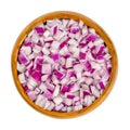 Diced red onions, cut onion cubes in a wooden bowl Royalty Free Stock Photo