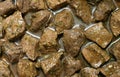 Diced sirloin beef chunks in marinade.