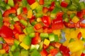 Diced yellow green and red peppers