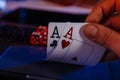 Dices and cards for poker in hand on laptop, online poker concept