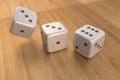 Three dice on wood floor Royalty Free Stock Photo