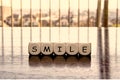 5 dices forming the Word `smile`