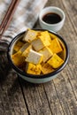 Dices of marinated tofu in bowl