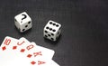 Dices and playing cards on a black background Royalty Free Stock Photo