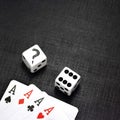 Dices and playing cards on a black background Royalty Free Stock Photo