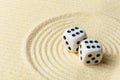 Dices on sand surface - abstract art composition Royalty Free Stock Photo