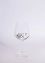 dices in a wine glass on a white background.minimal still life abstract design Royalty Free Stock Photo