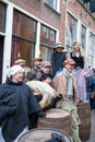 Dickens festival Christmas carol people sing at old wine barrels
