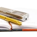 Dictaphone, notepad and ballpen Royalty Free Stock Photo