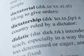 Dictionary page with the word dictatorship with selective focussing