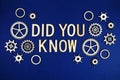 Did You Know alphabet letters with gears element on navy blue background Royalty Free Stock Photo