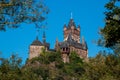 The castle Cochem on the Moselle towers over trees on a beautiful summer day Royalty Free Stock Photo