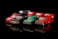 Die cast model car collection on the black reflective surface Royalty Free Stock Photo